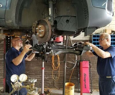 Mechanics fixing car